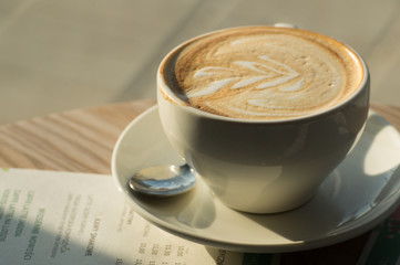 Cup of coffee on a wooden table