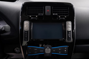 Modern car dashboard with screen multimedia. Interior detail.