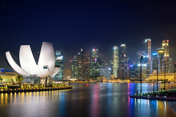 Singapore business district skyline in night at Marina Bay, Singapore.