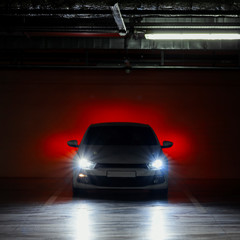 Exterior of white modern sport car at parking at evening time.