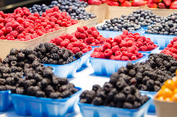 Closeup of different types of fresh berries at a market