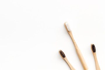 bamboo dental cleaning brush for zero waste lifestyle concept on white background top view mock up