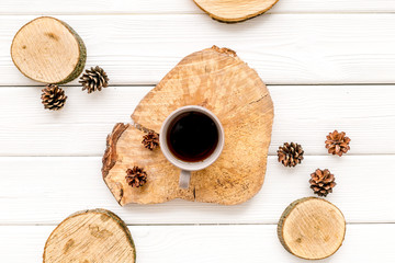 coffee, wooden stumps and pine cones for blog background top view