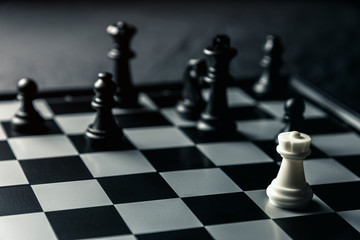 Chess board. White rook threatens black opponent's chess