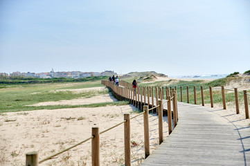 Wooden footwalk over the dunes in portugal near the beach