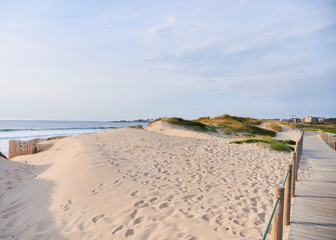 Wooden footwalk over the dunes in portugal near the beach