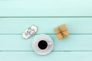 Happy Father Day with gift and coffee on mint green wooden background top view mockup