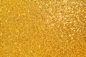 sparkle of golden glitter abstract background	
