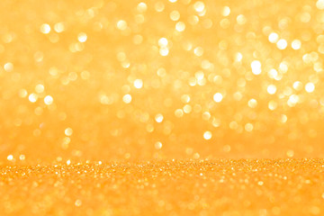 sparkle of golden glitter abstract background	