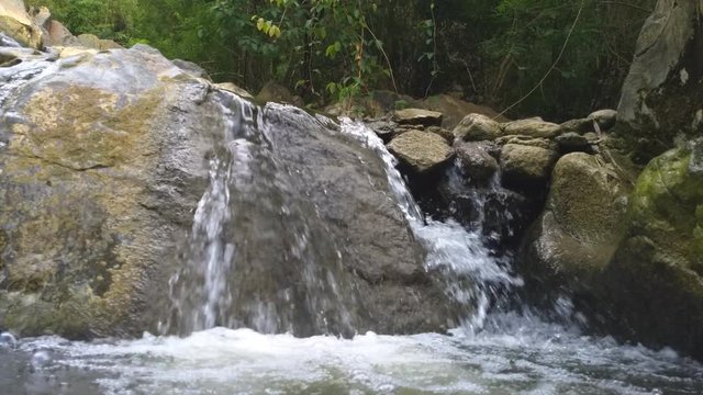 Waterfall in tropical forest.Water stream