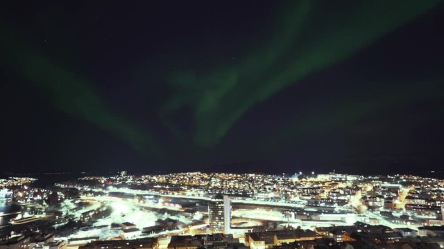 Timelapse over the city with the norhternlight passing over it. Narvik City in norhtern Norway.
