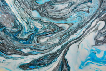 Abstract beautiful blue marble pattern with black color.The Eastern style of Ebru painting on water with acrylic paints swirls.A stylish mix of colors,natural luxury.