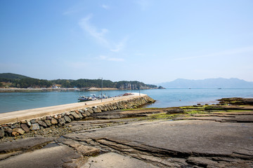Dinosaur Footprint and sedimentary rocks in famous tourist site Sangjogam County Park in Goseong County, South Korea.