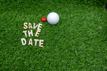 Golf save the date with love on green grass.