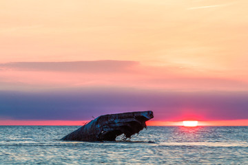 Sunset Beach and the sunken SS Atlantic at sunset in early spring with warm vivid light - Cape May...