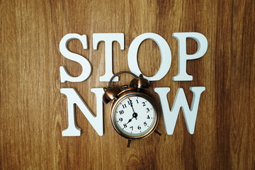 Stop Now Word alphabet letters on wooden background