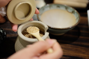 White sesame on the spoon and bowl