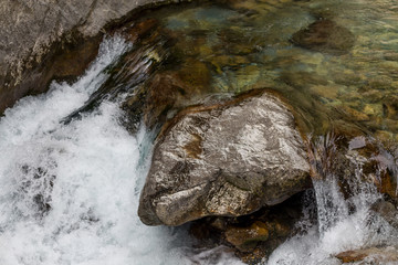 Powerful water stream in the mountain river