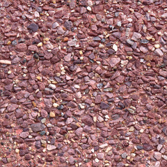 Seamless tiles of little red stones.