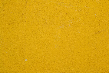 Yellow concrete wall. Background for design, screen saver, texture