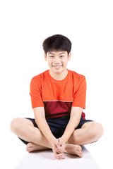 Fototapeta na wymiar Portrait Young Asian boy sitting over white background,