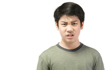 Portrait Young Asian boy over white background, be upset; have a bad temper emotional portrait of teen boy wearing t-shirt. Thoughtful teenager, isolated on white background. 