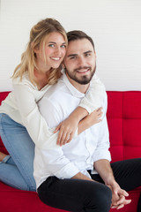 Couple happy on Sofa in their living room