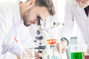 scientists conducting research in a lab environment. science laboratory research and development concept