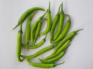 organic green chili pepper on white background