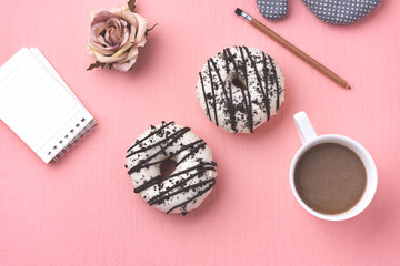space donut with coffee on pink background 