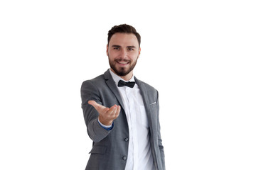 Man is standing and shows outstretched hand with open palm. Businessman hand touching virtual screen