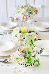 Floral decorations on summer party table.