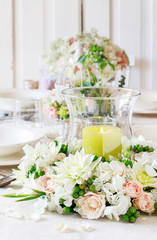 Floral decorations on summer party table.