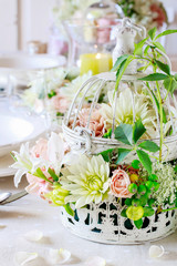 Floral decorations on summer party table.