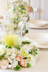 Floral decorations on summer party table.