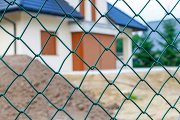 Fence mesh in front of the building.