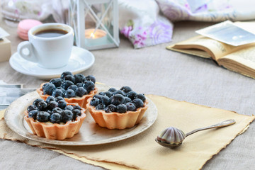 Bluberry cakes on silver plate.