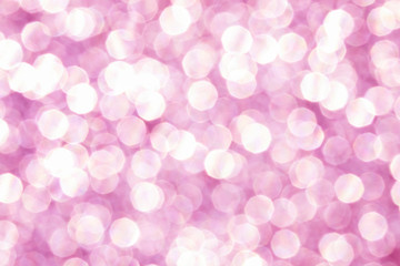 Pink glittering christmas lights. Blurred abstract background.