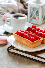Raspberry cake on white plate.