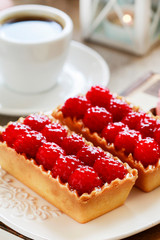Raspberry cake on white plate.