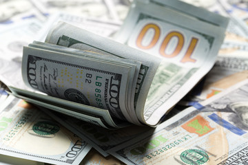 Fototapeta premium American dollars. A stack of hundred dollar bills. Close up