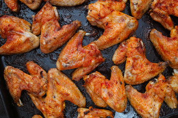Crispy baked chicken wings. Top view, flat lay