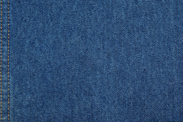 textured background of denim with vertical and diagonal seam
