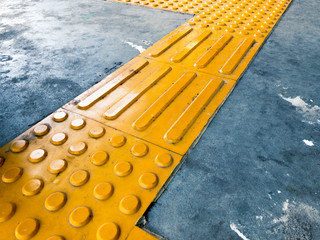 Yellow Dome and Block of Tactile Paving Which Act as A Guidance for Visually Impaired or Blind Citizen To Avoid Hazard on Street or Public Transport Such as Train Station or Subway Platform
