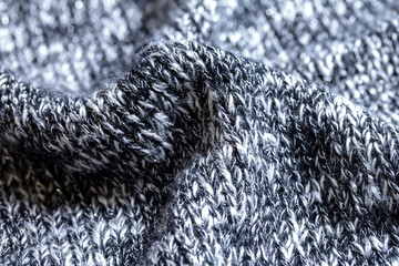 黒と白の霜降りニットの背景