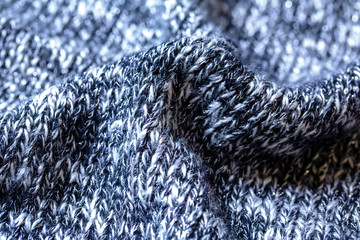 黒と白の霜降りニットの背景