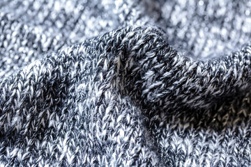 黒と白の霜降りニットの背景