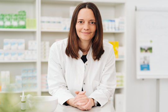 Smiling female pharmacist looking at camera