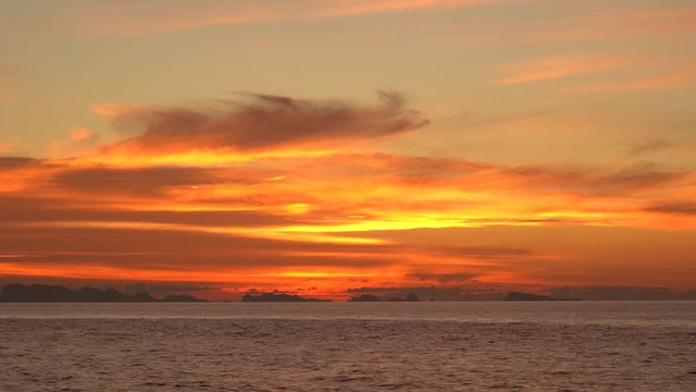 Beautiful sunset over sea water wave. Summer vacation concept. Island Koh Phangan, Thailand, establishing shot