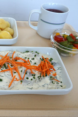 Dill snack with butter cheese and potatoes in a canteen in Germany